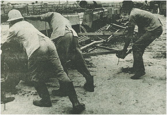 Workers moving equipment by brute force, CAIL, Mozambique, 1982