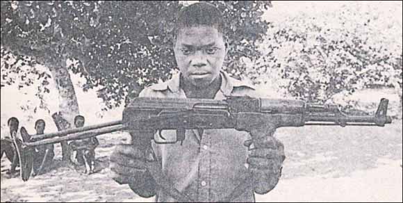 Renamo prisoner with gun