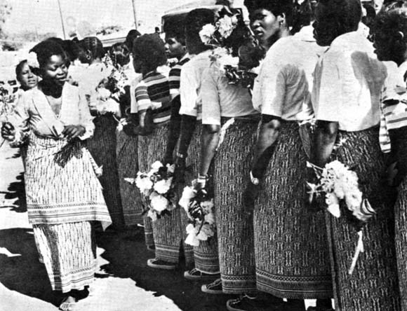 Mozambican cultural group with flowers